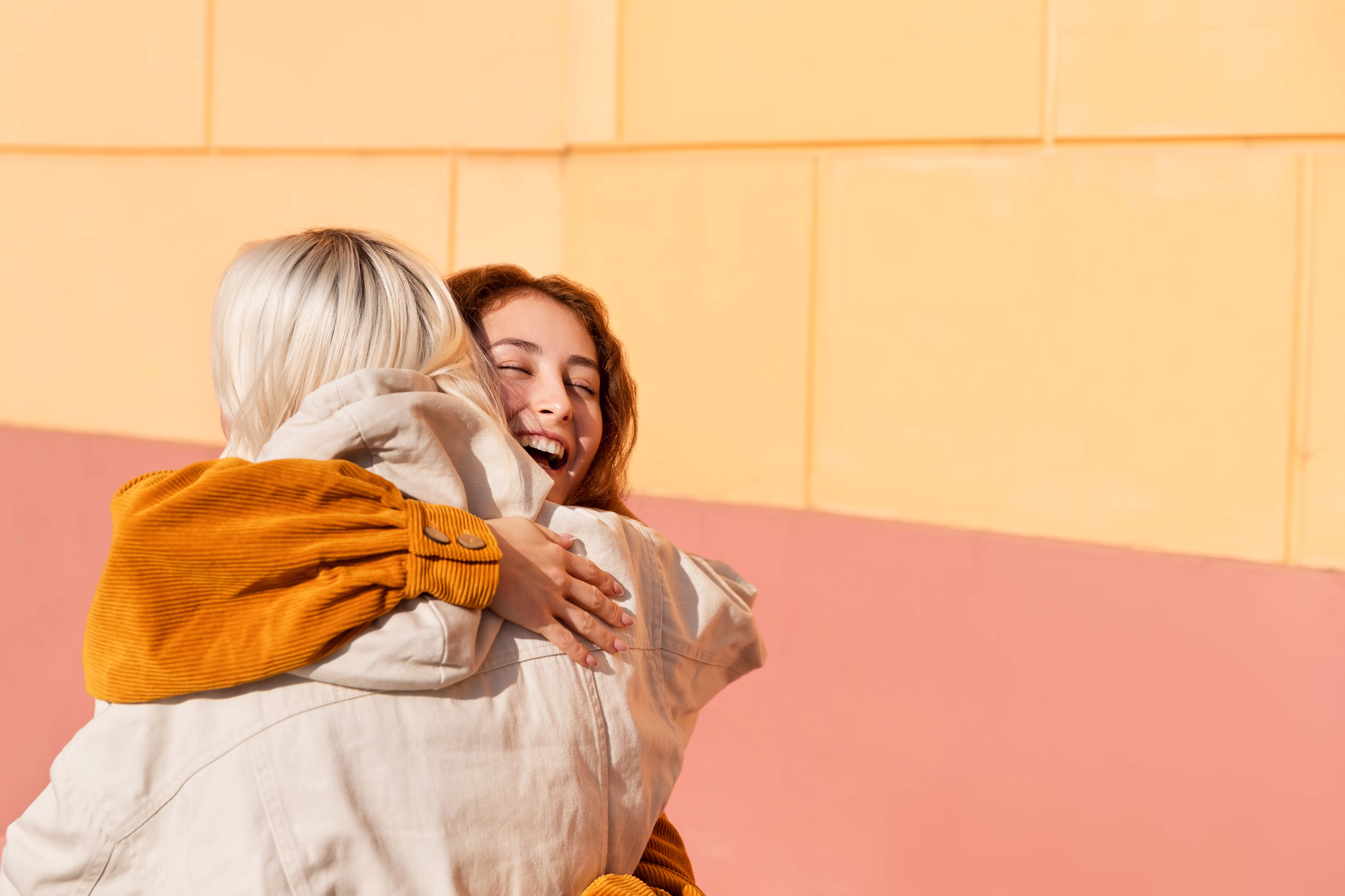 Group of women talking and laughing together outdoors