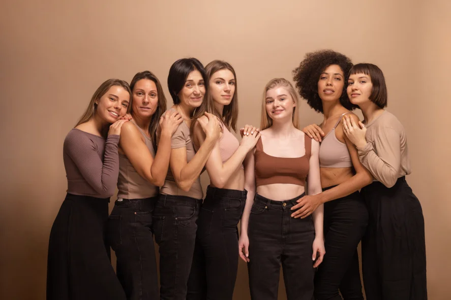 A group of women standing next to each other.
